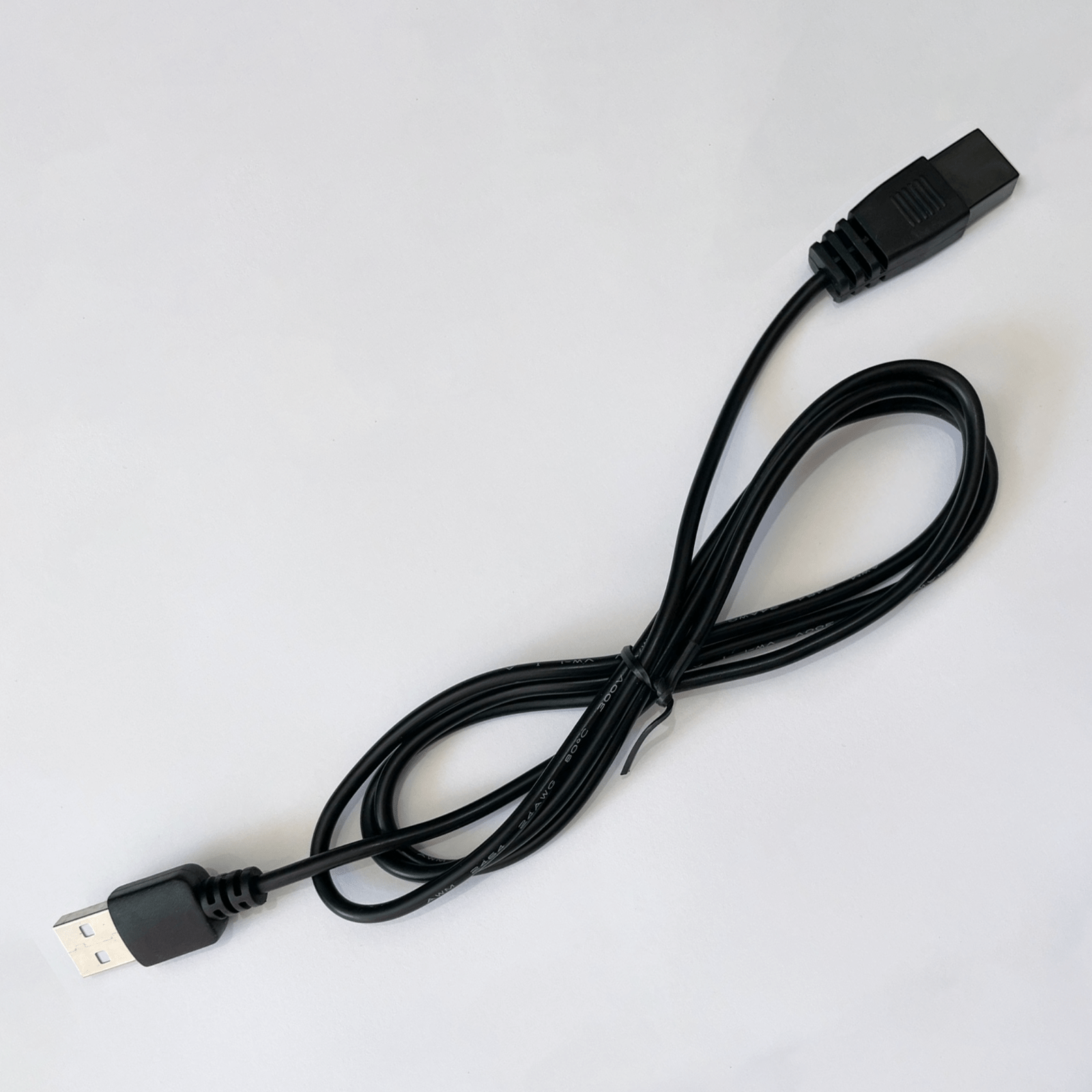 A black Pool Vacuum Charging USB Cable Replacement for Bestway / Lay-Z-Spa on a white surface.